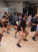 A group of people having a great time dancing, smiling and having fun whilst working out with JiggleFiTT