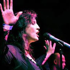 Gig at O2 Bubble image of middle aged white woman singing at mic