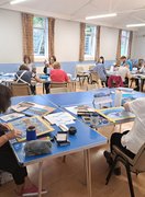 Happy students drawing with pastels in our Hayes class