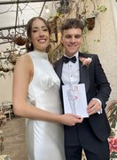 Beautiful bride and groom with illustration created at their wedding, by Zoe Parker Illustration