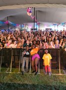Nana posing with a large smiley and happy audience after doing a samba funk workshop at Love Supreme.