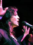 Gig at O2 Bubble image of middle aged white woman singing at mic